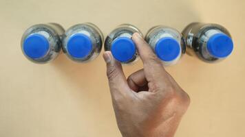 top view of hand pick a soft drinks bottle video