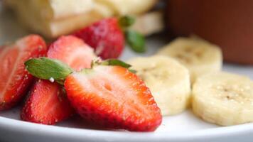 Ripe Red Strawberries in a bowl on table video