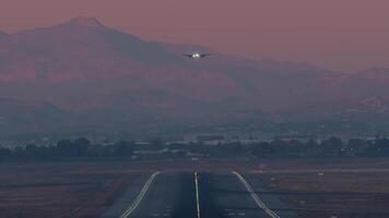 Airplane landing at dusk video