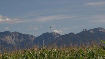 The plane is flying over the mountains video