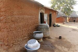 Village in the north of Benin with the name Kalale. The tribal people have their own language and live from farming. Many houses are mud houses. photo