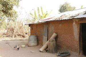 Village in the north of Benin with the name Kalale. The tribal people have their own language and live from farming. Many houses are mud houses. photo