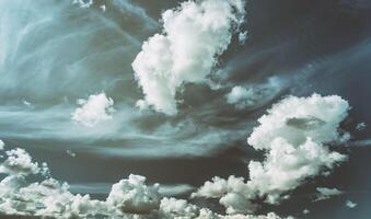 White cumulus clouds in the blue sky. Aesthetics of vintage film. photo