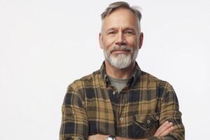 Portrait of smiling mature man standing on white background. photo