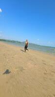 Caucasian woman running on the beach in Thailand in slow motion video