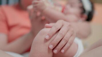 Child drinking milk from a baby bottle Mom bonded in a white bedroom. video