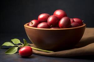 Ripe jujube fruit in a wooden bowl. Sweet and nutritious red Ziziphus. Chinese red date fruit. Concept of healthy eating, natural snacks, fruit servings, and nutritious choices photo