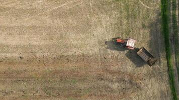 Top View Of Tractor Fertilizing Farm Field. video