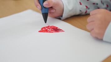 Close-up of girl creating plastic 3D model on paper at table video