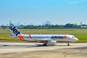 An Airbus A320 aircraft belonging to Jetstar airline is heading towards the runway via the taxi way at Juanda International Airport, Surabaya, Indonesia, 29 July 2023. photo