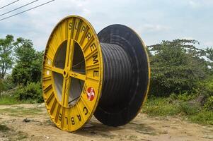 large roll of electrical cable belonging to the State Electricity Company PLN, Indonesia, 16 January 2024. photo