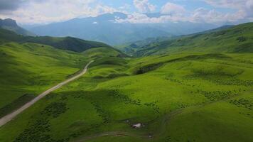 Actoprak's green mountain pass aerial view day's charm cloud embrace majestic Mountain pass scenic wonder rejuvenating retreat captivating. Mountain pass aesthetic joy pristine wilds untouched. video