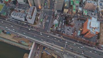 Seoul, South Korea - January 24, 2024. Urban movement animates city lifeblood flowing top view Urban movement persists in every corner symbolizing ceaseless rhythm. Urban traffic connects the big city video