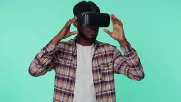 Man using virtual reality futuristic technology VR headset helmet to play simulation 3D game video