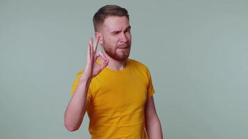 Stylish man looking approvingly at camera showing ok gesture like sign positive something good video