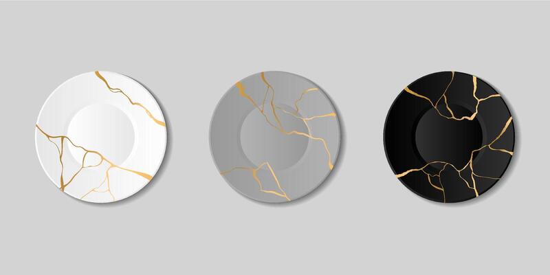 Kintsugi, broken plates with golden cracks, japanese art of repair. Repairing cracked pottery with gold, marble pattern plate set. Black, grey and white tableware of different shapes