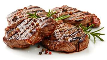 grilled beef steaks with spices isolated on white background photo