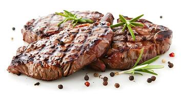 grilled beef steaks with spices isolated on white background photo