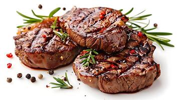 grilled beef steaks with spices isolated on white background photo