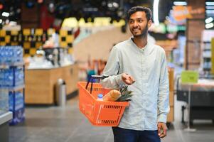 Man at grocery store products photo