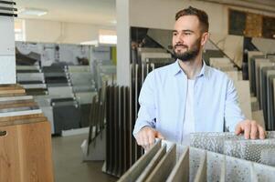 Man choosing tiles at building market photo