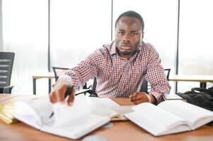 African American student passing exam photo