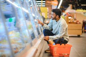 Man at grocery store products photo
