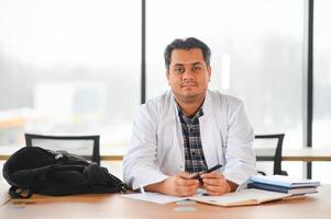 Portrait of a young doctor student studying photo