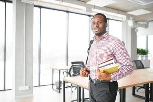 black student at university classroom and thinking of something photo