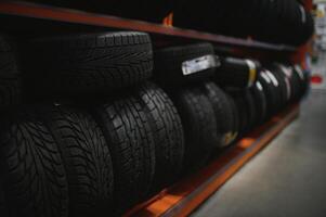 Car tires at warehouse in tire store photo