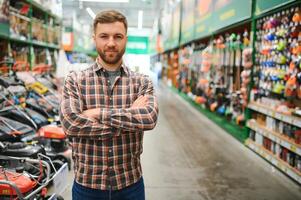 Young man working in hardware store photo