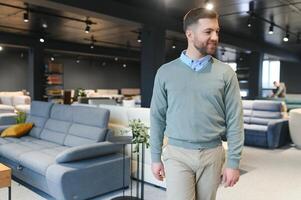 man chooses furniture in a store photo