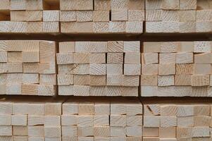 Perspective angle of wooden planks in close-up at a lumber warehouse photo