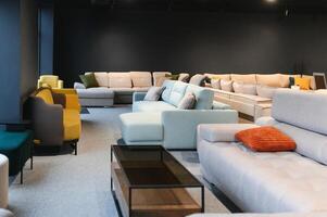 Interior of furniture salon shopping room with sofas photo