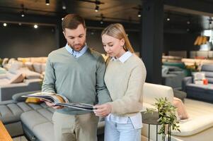 Attractive woman with her husband at the furniture store showroom photo