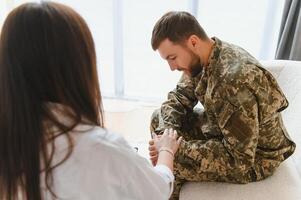 Therapy, support and military man with psychologist talking about ptsd. photo