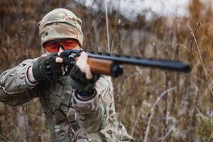 Hunting permit. Man brutal gamekeeper nature background. hunter spend leisure hunting. Hunter hold riffles. Focus and concentration of experienced hunter. Hunting and trapping seasons photo