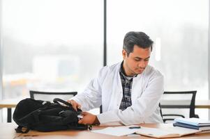 Portrait of a handsome Indian medical student. The concept of higher education. photo