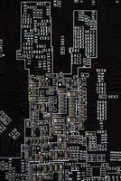 A brown printed circuit board with resistors and capacitors. An electronic board with radio elements. photo