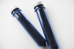 Two blue plastic flasks with a shiny lid. Flasks with tea inside. photo