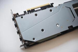 The case of the card on a white background. A device for a computer. The radiator of the card. photo