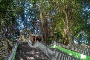 high and long stairs leading to the historic ancient Islamic burial complex of Sunan Giri photo