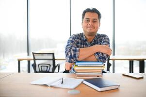 Portrait of cheerful male international Indian student with backpack. Education concept photo