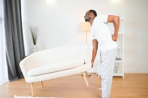 Young African Man Having Back Pain photo