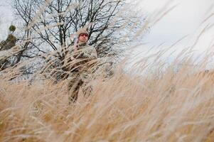 Hunting permit. Man brutal gamekeeper nature background. hunter spend leisure hunting. Hunter hold riffles. Focus and concentration of experienced hunter. Hunting and trapping seasons. photo