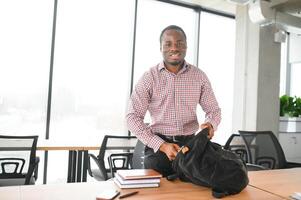 Male student sitting in university classroom. Man sitting in lecture in high school classroom. photo