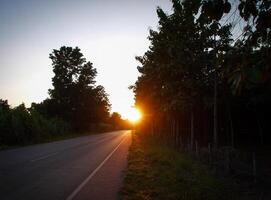 Spectacular sunset over, orange sun rising up over the horizon photo