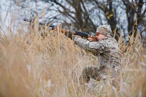 Hunting permit. Man brutal gamekeeper nature background. hunter spend leisure hunting. Hunter hold riffles. Focus and concentration of experienced hunter. Hunting and trapping seasons photo