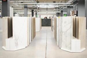 Interior photography of plumbing establishment where tiles, bathtubs, furniture and toilets are sold photo