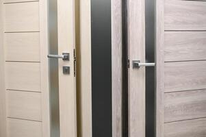 Doors are sold at a hardware store. Choosing doors for the house close-up. Interior renovation concept photo